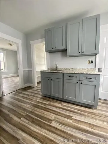 a view of a kitchen counter space and sink