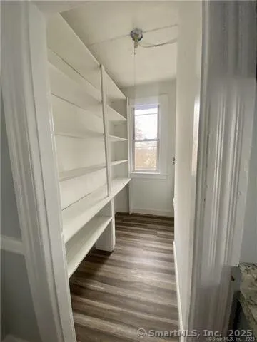 a view of an empty room and a window