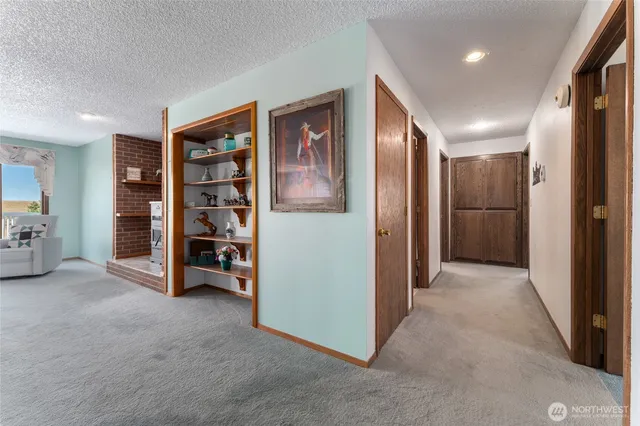 a view of a livingroom with furniture and a window
