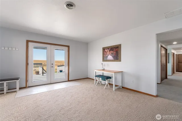 a view of a living room with furniture and a flat screen tv