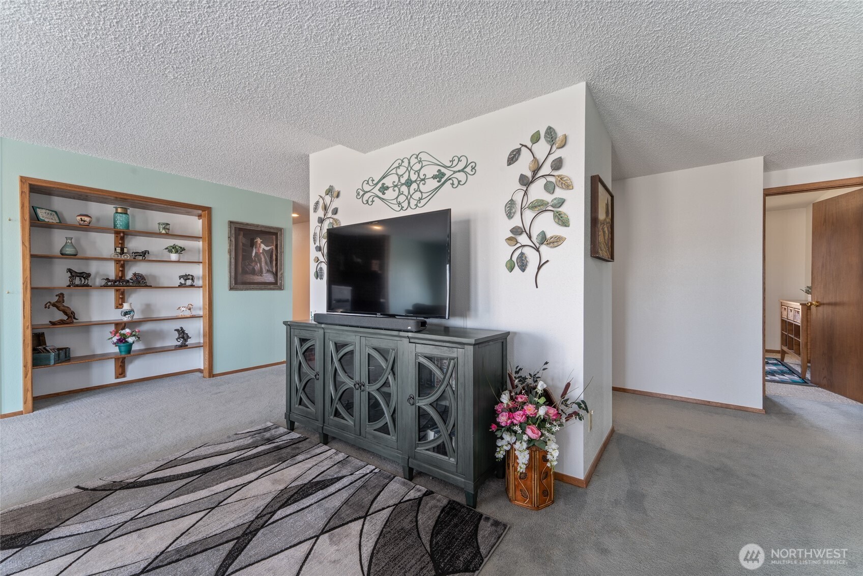 6397 Coyote Heights Road North Odessa, WA 99159 - Photo 14 of 40 a view of a living room with furniture and a flat screen tv