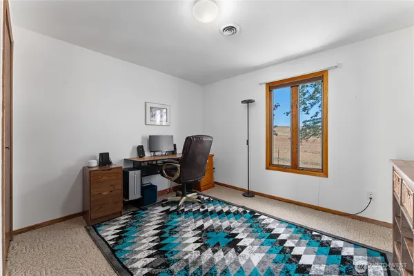 a bedroom with a bed and a cabinets