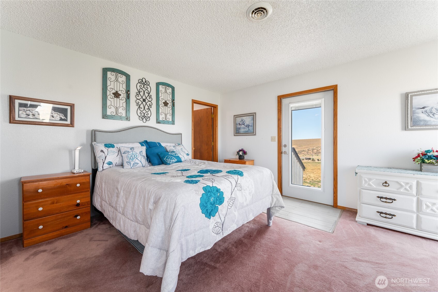 6397 Coyote Heights Road North Odessa, WA 99159 - Photo 19 of 40 a bedroom with a bed and a cabinets