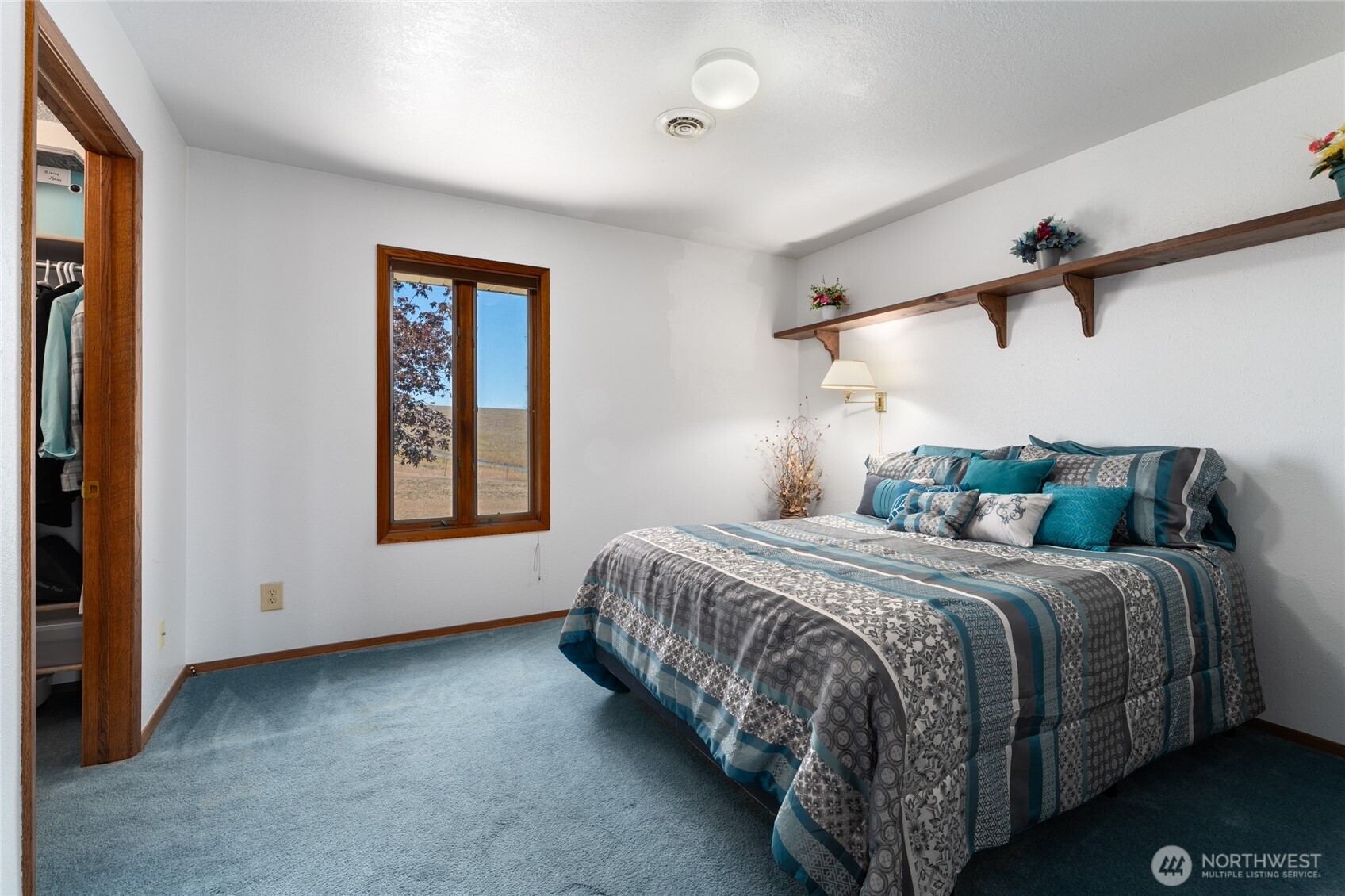 6397 Coyote Heights Road North Odessa, WA 99159 - Photo 3 of 40 a bedroom with a bed and a window