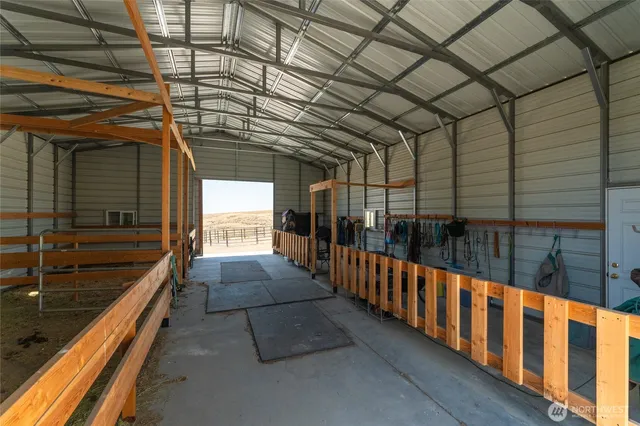 a sitting area with lamp in front of it