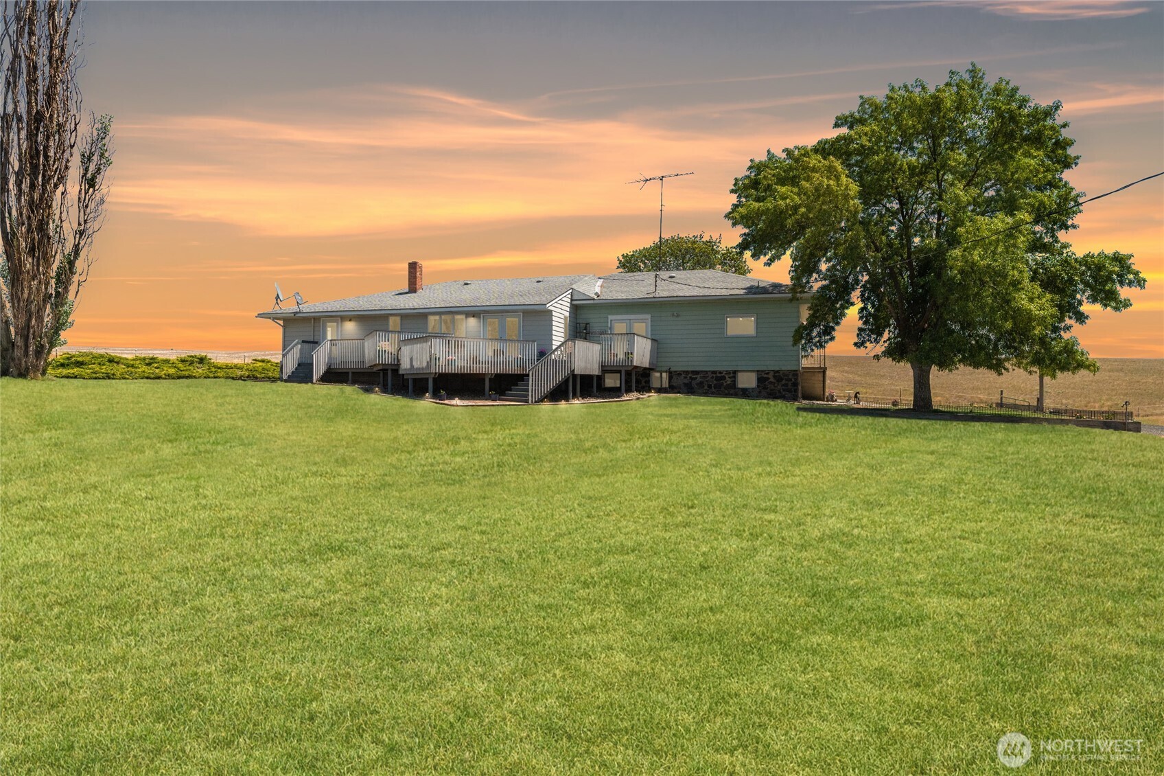 6397 Coyote Heights Road North Odessa, WA 99159 - Photo 35 of 40 a view of a house with a big yard and large trees