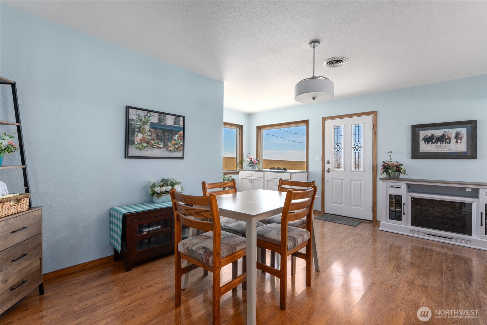 6397 Coyote Heights Road North Odessa, WA 99159 - Photo 4 of 40 a view of a dining room with furniture window and wooden floor