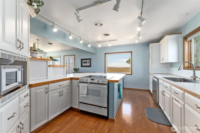 a living room with furniture and white walls