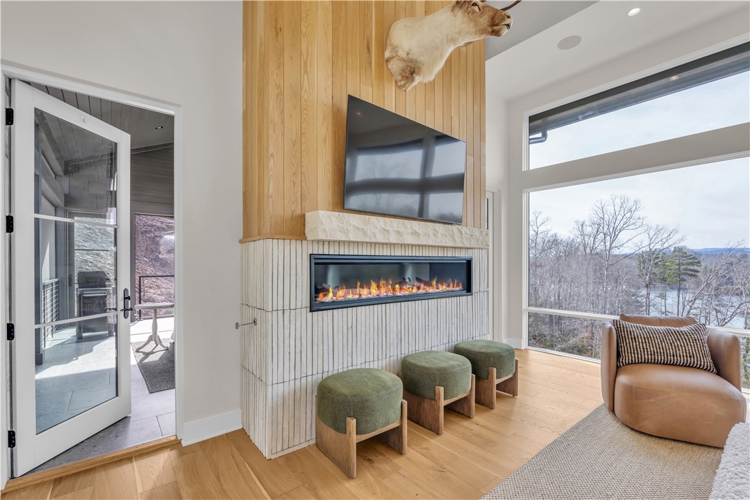 127 Crosswind Court Sunset, SC 29685 - Photo 23 of 49 This bright living space offers warmth, expansive views, and access to outdoor relaxation.