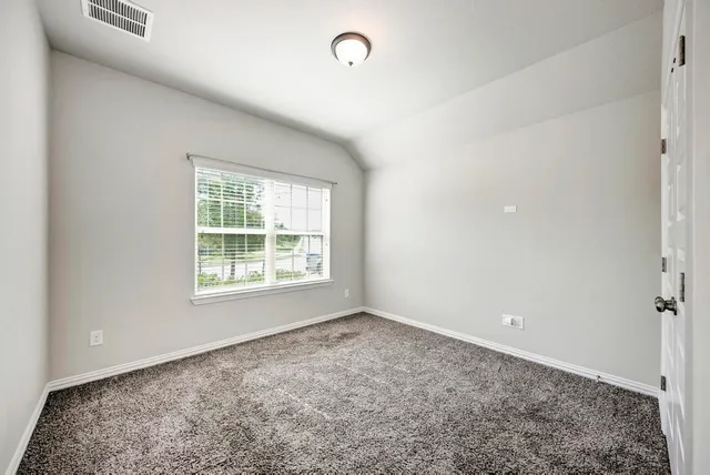 an empty room with a empty space and window
