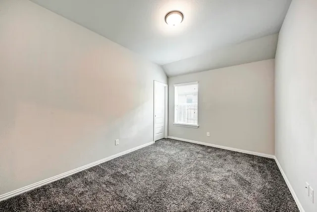 a view of a backyard with a garden and plants