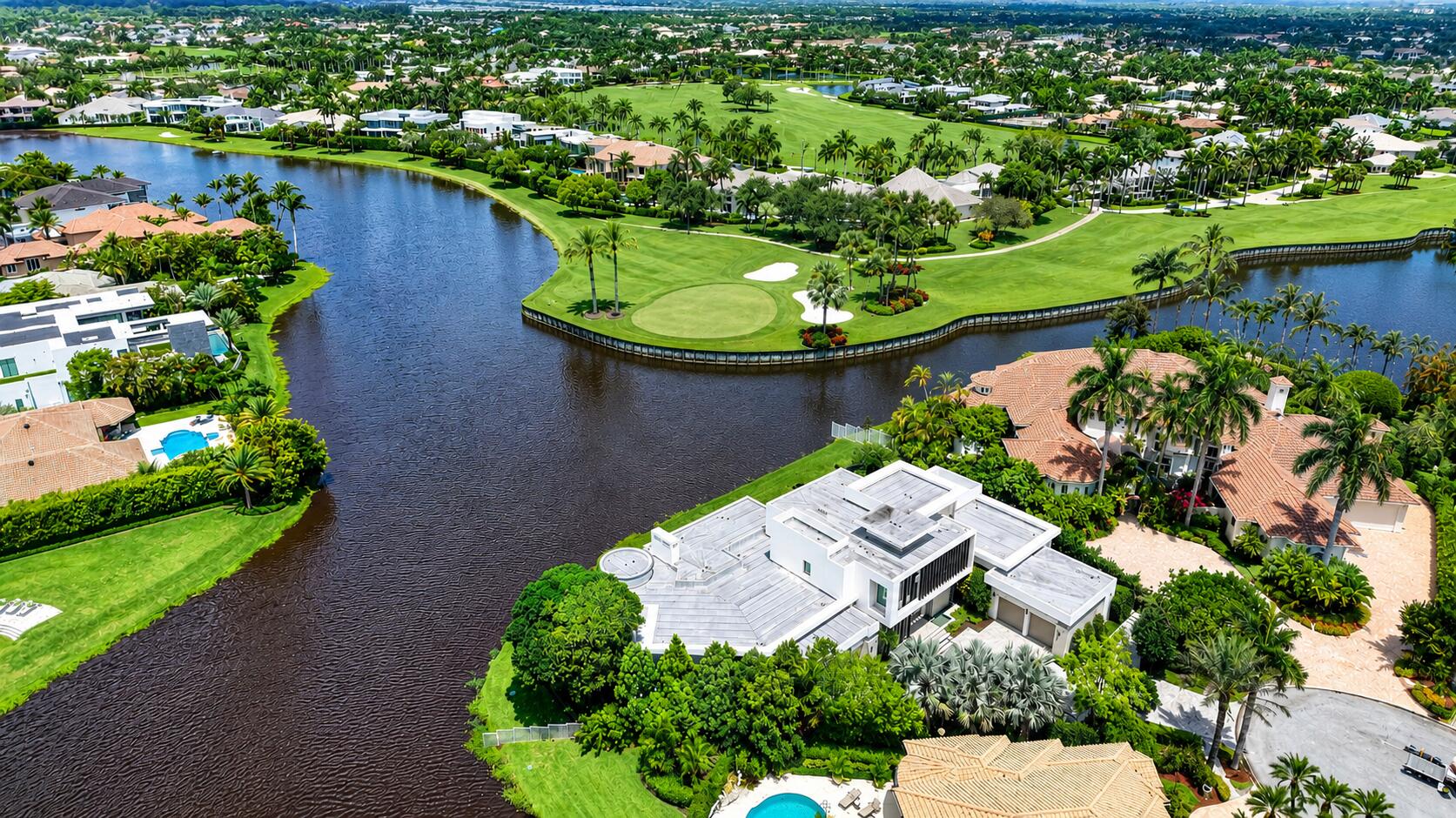 6960 Lake Estates Court Boca Raton, FL 33496 - Photo 58 of 58 an aerial view of a house with a yard and outdoor seating