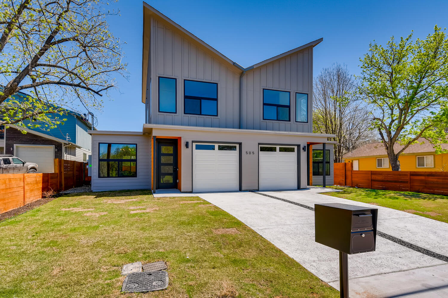 505 Kemp Street Austin, TX 78741 - Photo 34 of 34 Modern curb appeal with a sharp roofline, clean lines, fenced green space, and an attached garage that keeps things practical.