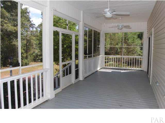 1847 Pearson Road Milton, FL 32583 - Photo 13 of 23 Scrrened-in porch off of master bedroom and living room