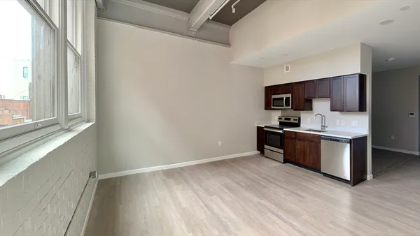 a kitchen with a refrigerator stove and microwave