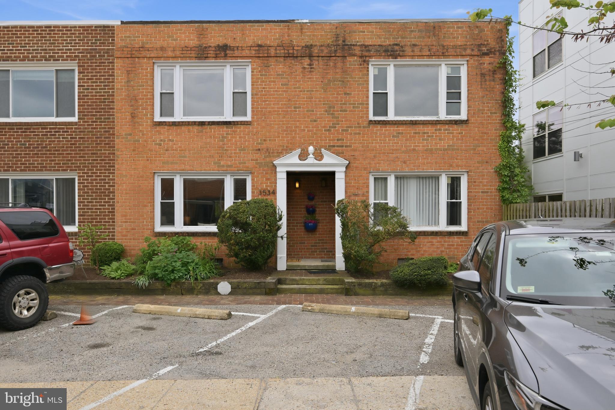 3534 6th Street Northwest Washington, DC 20010 - Photo 1 of 25 a front view of a house with parking area