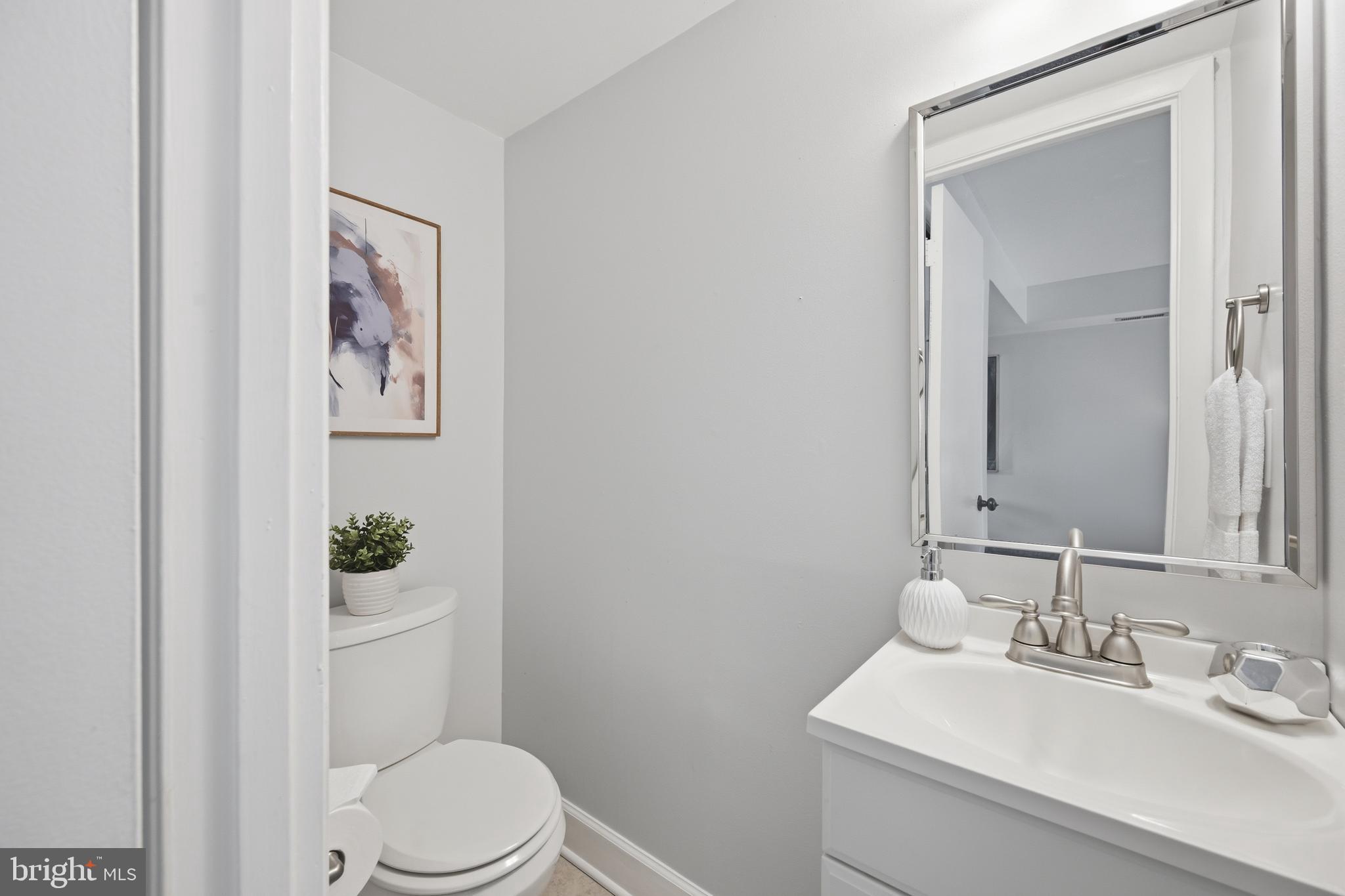 3534 6th Street Northwest Washington, DC 20010 - Photo 11 of 25 a bathroom with a sink mirror vanity and toilet