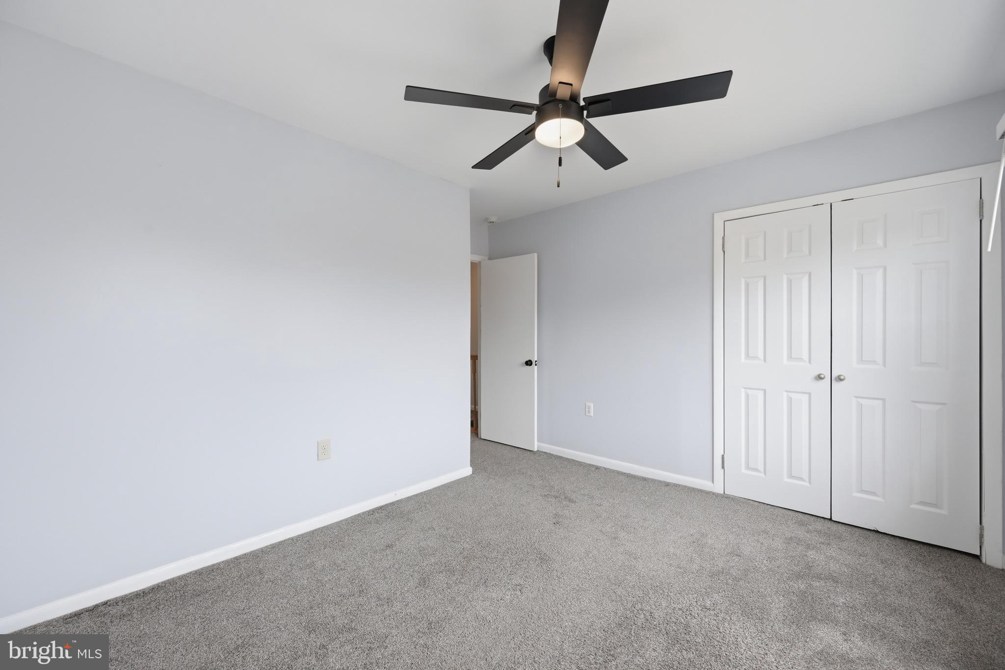 3534 6th Street Northwest Washington, DC 20010 - Photo 20 of 25 a view of an empty room with a chandelier fan