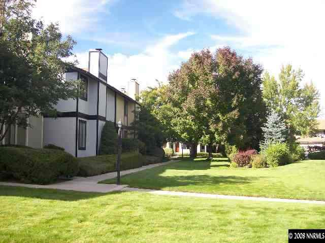 1435 Foster Drive Reno, NV 89509 - Photo 4 of 9 a front view of a house with a yard and trees