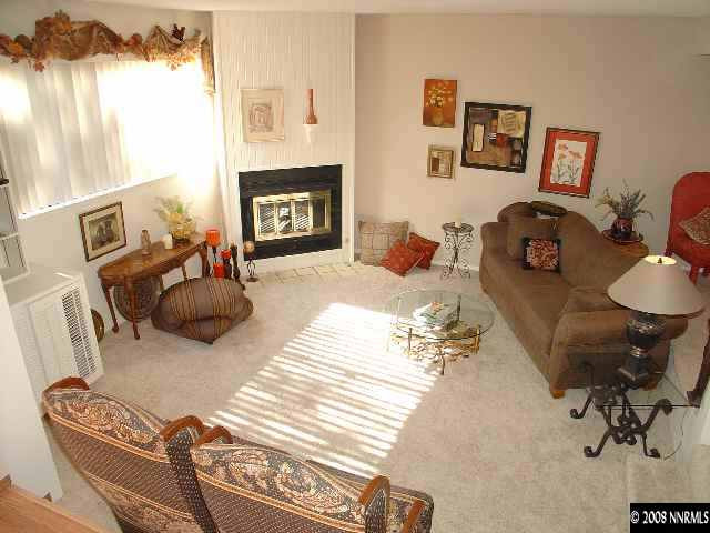 1435 Foster Drive Reno, NV 89509 - Photo 8 of 9 a living room with furniture and a fireplace