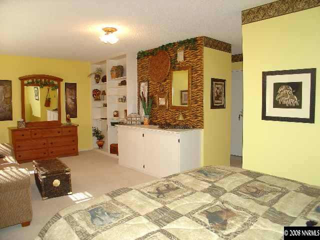 1435 Foster Drive Reno, NV 89509 - Photo 9 of 9 a bedroom with a bed and dresser