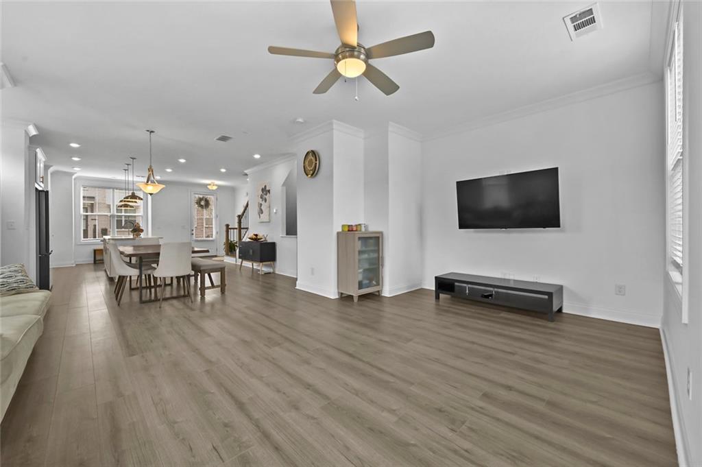 3217 Bartee Walk Suwanee, GA 30024 - Photo 19 of 36 a view of a livingroom with furniture and a flat screen tv