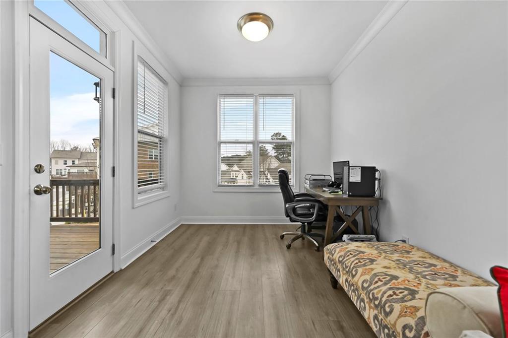 3217 Bartee Walk Suwanee, GA 30024 - Photo 20 of 36 a view of a workspace with furniture and a window
