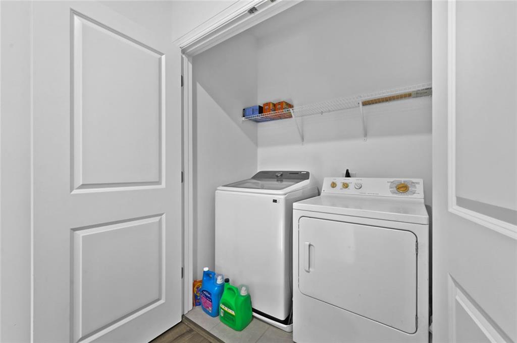 3217 Bartee Walk Suwanee, GA 30024 - Photo 24 of 36 a utility room with dryer and washer