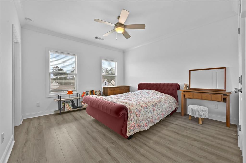 3217 Bartee Walk Suwanee, GA 30024 - Photo 25 of 36 a bedroom with a bed and window