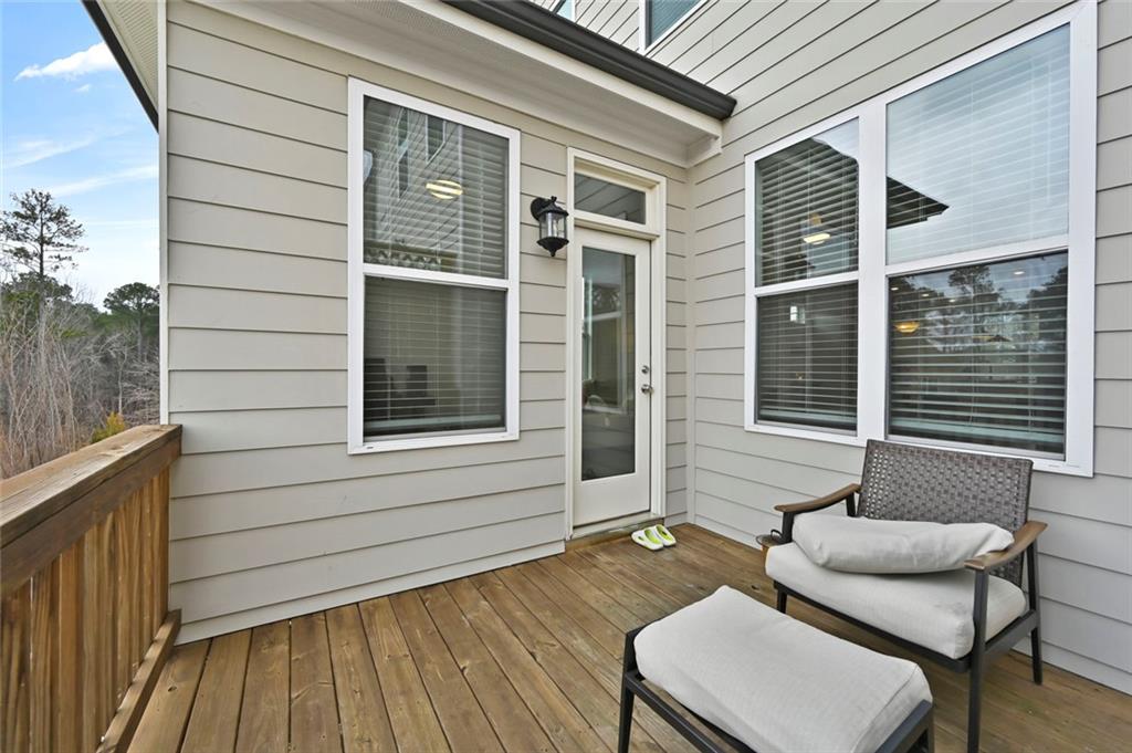 3217 Bartee Walk Suwanee, GA 30024 - Photo 32 of 36 a view of a chair and tables in the balcony