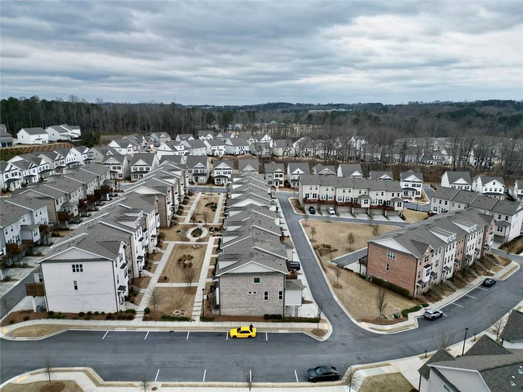 3217 Bartee Walk Suwanee, GA 30024 - Photo 4 of 36 an aerial view of residential houses with outdoor space