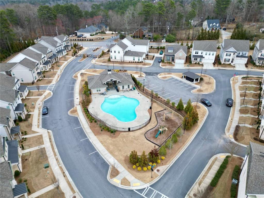 3217 Bartee Walk Suwanee, GA 30024 - Photo 8 of 36 an aerial view of a swimming pool with outdoor seating