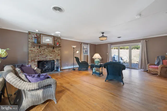 a view of living room with furniture and fireplace