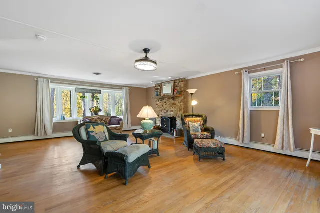 a kitchen with granite countertop white cabinets and stainless steel appliances