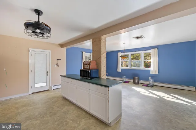 a view of an empty room with a window