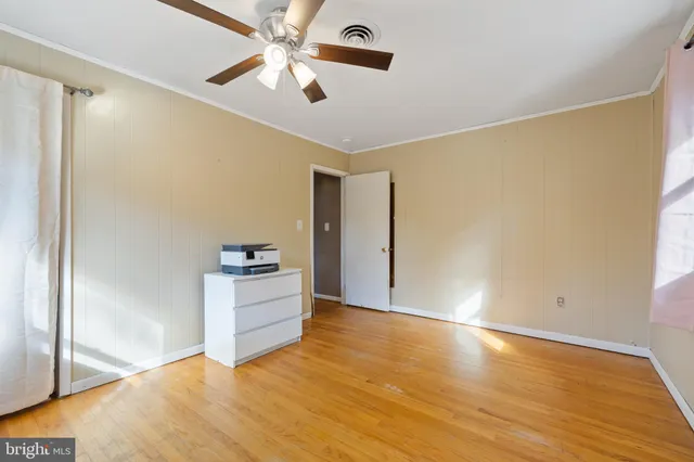 a view of a chairs and table on the wooden floor