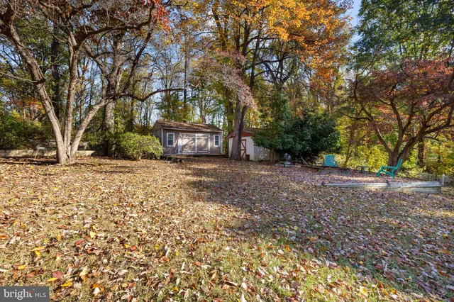a view of a workspace with furniture and wooden floor