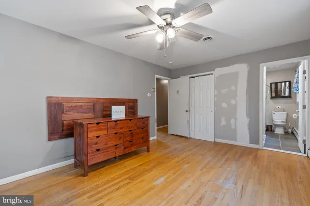 a view of a backyard with large trees