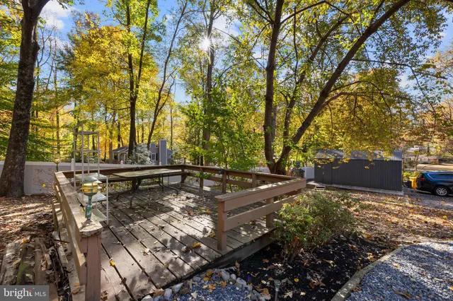 a view of a backyard with sitting area