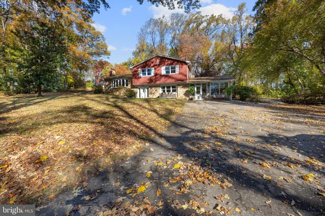 a sign board with yard in the back