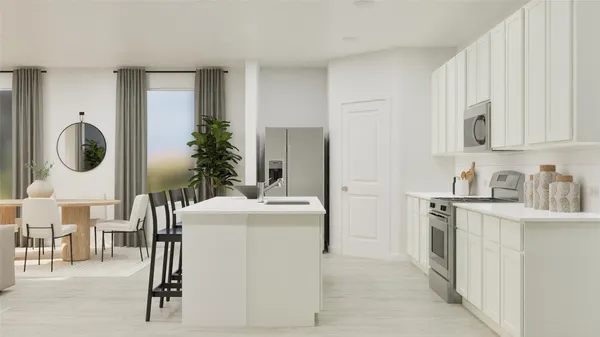 a kitchen with a refrigerator and a stove top oven