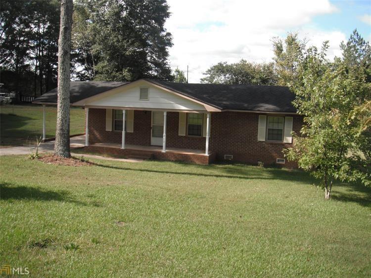 462 Cason Road Cedartown, GA 30125 - Photo 1 of 1 a front view of a house with a garden and trees
