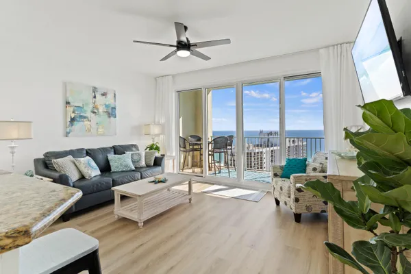 a living room with furniture and a large window