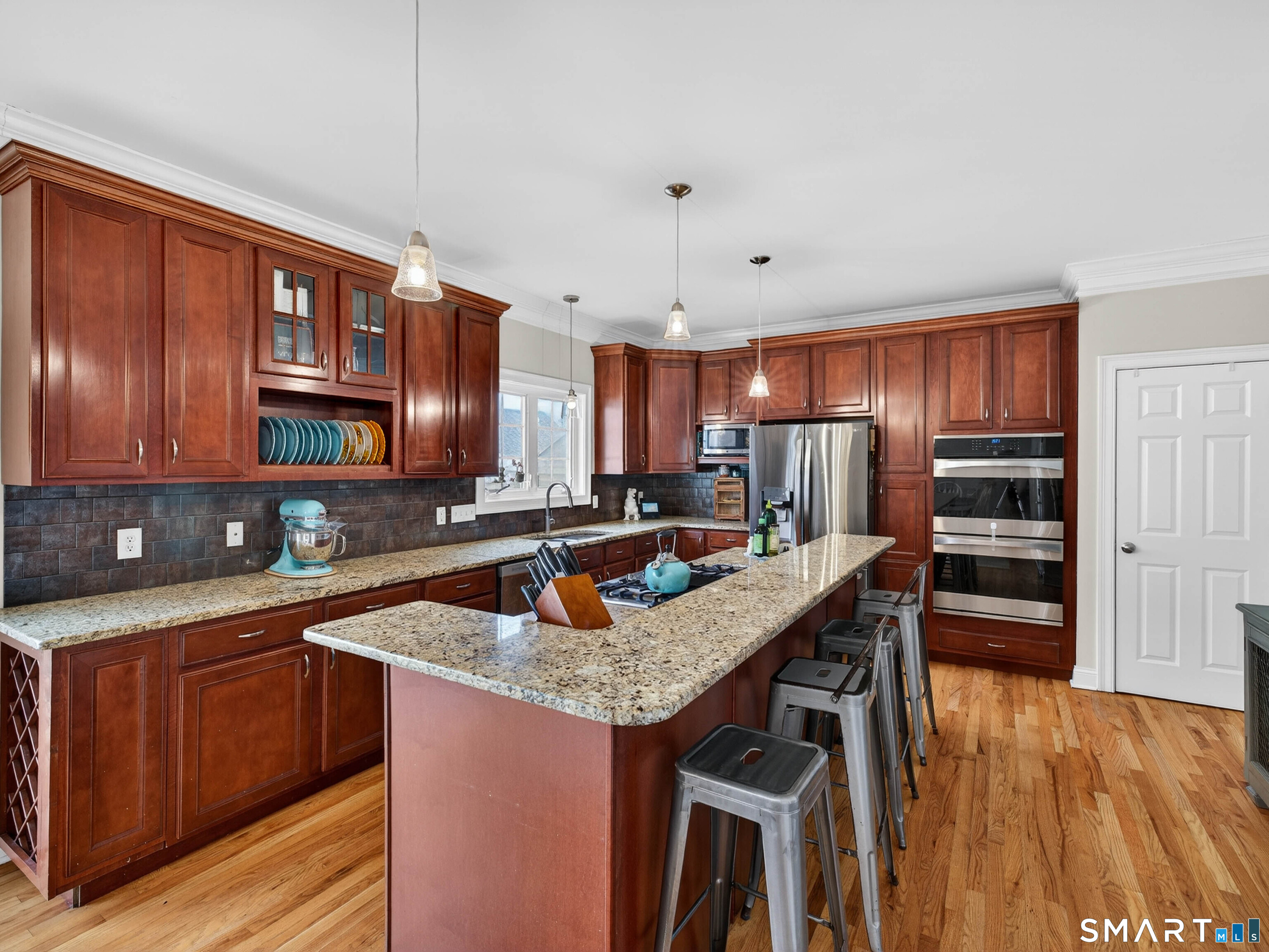 6 Constance Street New Haven, CT 06512 - Photo 15 of 39 a kitchen with stainless steel appliances granite countertop a sink stove and refrigerator