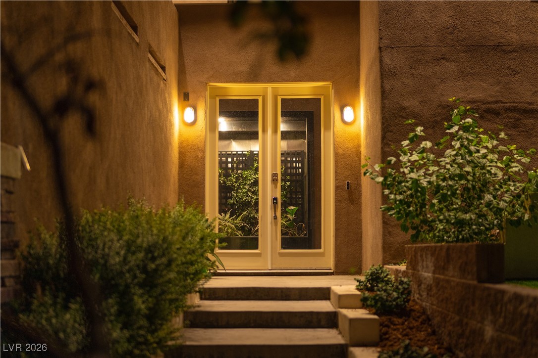 2817 High View Drive Henderson, NV 89014 - Photo 10 of 77 Entrance to property with french doors and stucco siding