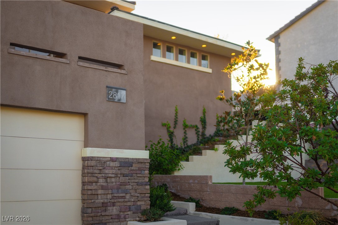 2817 High View Drive Henderson, NV 89014 - Photo 13 of 77 View of property exterior featuring stucco siding