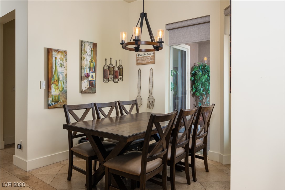 2817 High View Drive Henderson, NV 89014 - Photo 28 of 77 Dining space featuring a chandelier and baseboards