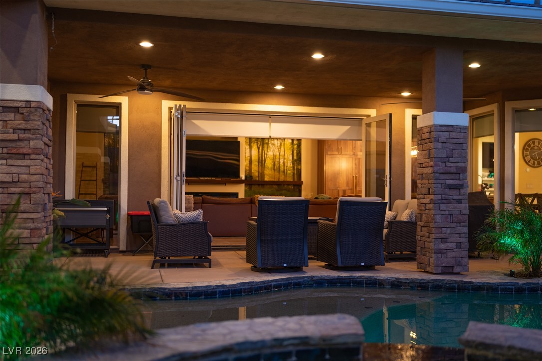 2817 High View Drive Henderson, NV 89014 - Photo 34 of 77 View of patio featuring an outdoor pool, a ceiling fan, and an outdoor hangout area