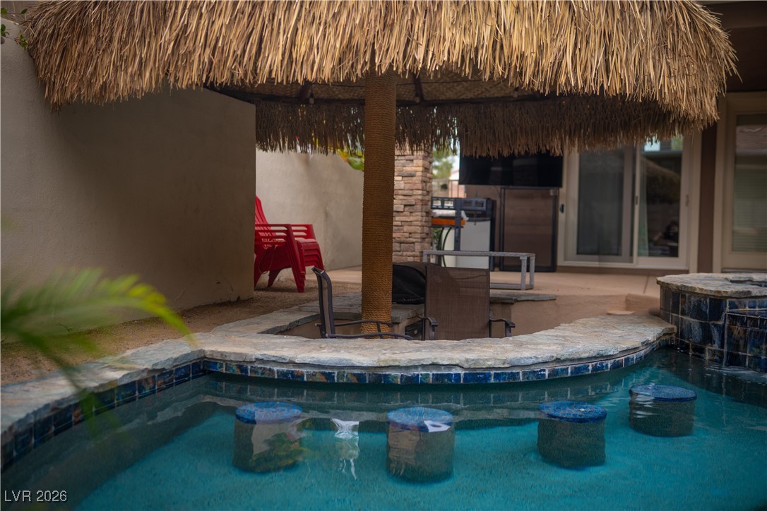 2817 High View Drive Henderson, NV 89014 - Photo 46 of 77 Outdoor pool featuring a patio and exterior kitchen