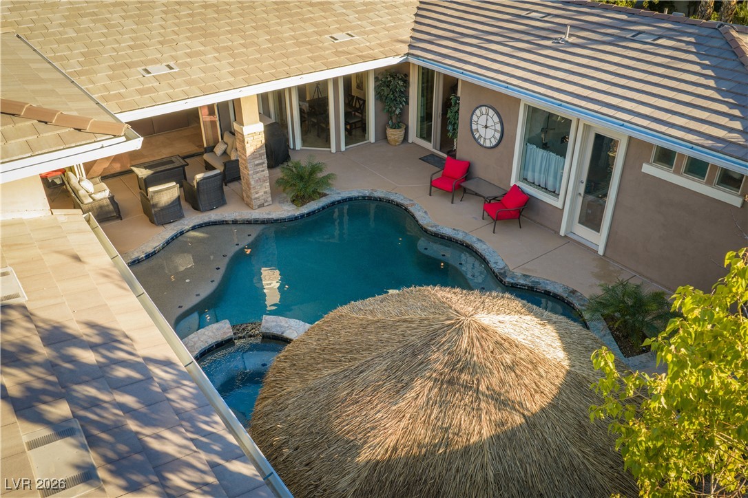 2817 High View Drive Henderson, NV 89014 - Photo 49 of 77 View of swimming pool featuring a patio area and a pool with connected hot tub